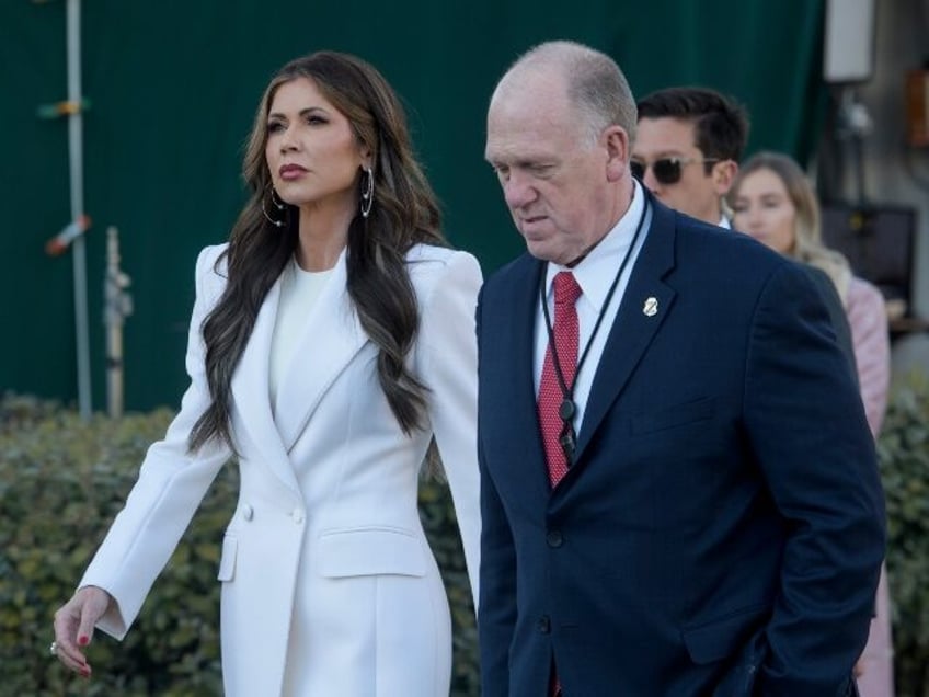 Homeland Security Secretary Kristi Noem, left, and White House border czar Tom Homan walk