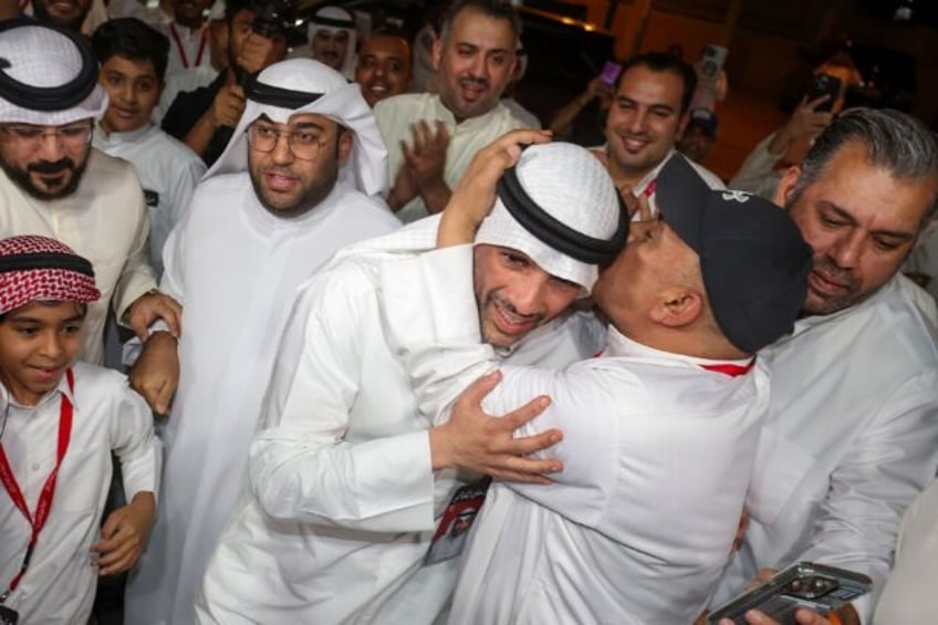 Supporters hail former parliament speaker Marzouq al-Ghanim after his election win