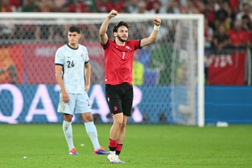 Khvicha Kvaratskhelia celebrates Georgia's second goal during their 2-0 victory over Portu