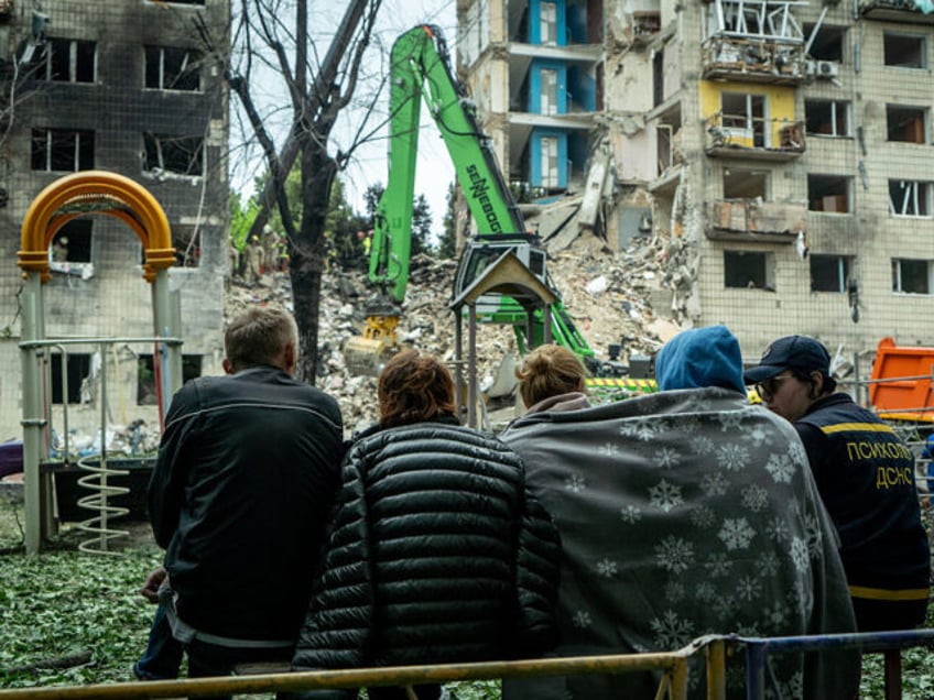 KYIV, UKRAINE - JUNE 17: A psychologist of State Emergency Service provides aid to people