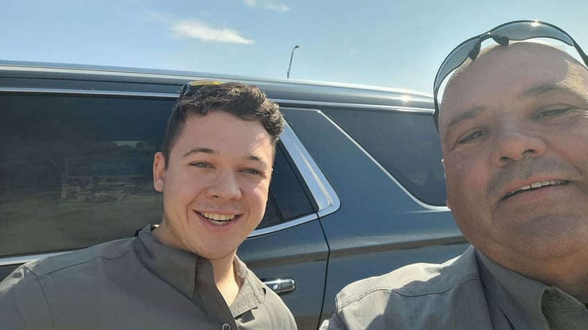 rittenhouse smiling with officer