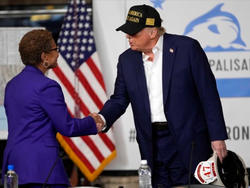 President Donald Trump shakes hands with Los Angeles Mayor Karen Bass after a briefing in