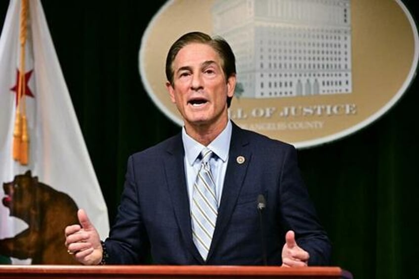 la district attorney announces charges against 30 people over anti ice protests
