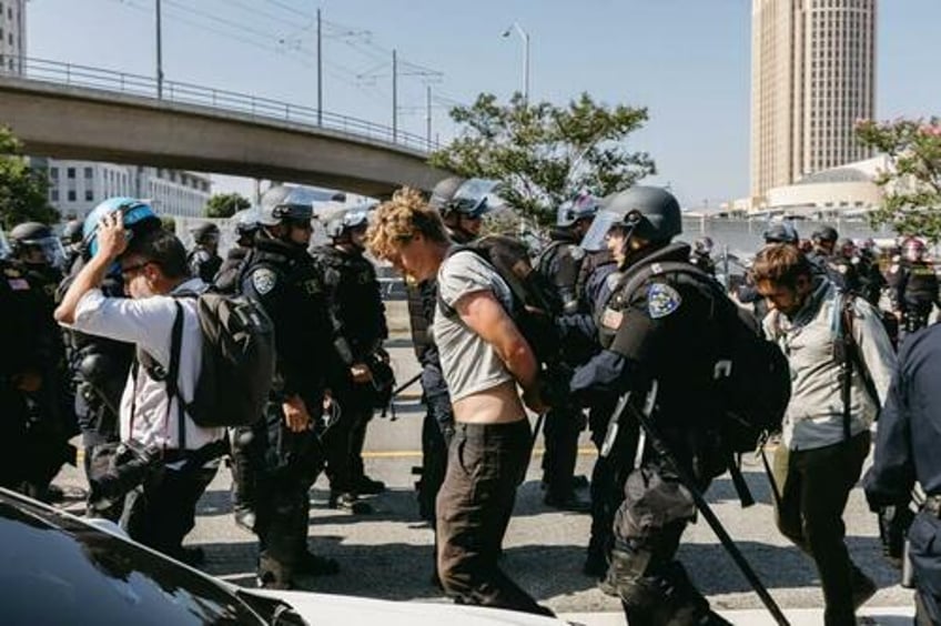 la district attorney announces charges against 30 people over anti ice protests