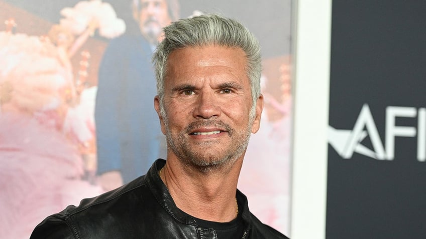 Actor Lorenzo Lamas sports black leather jacket and shirt