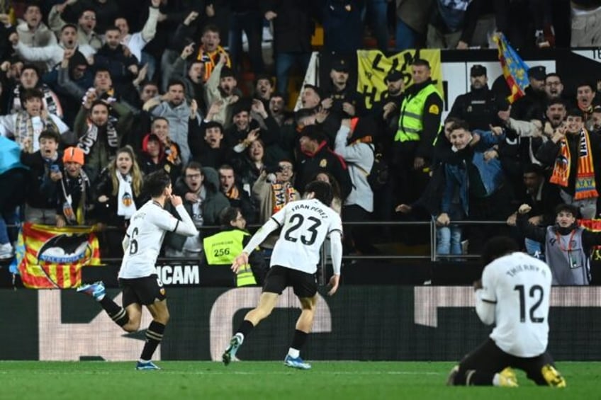 Valencia's Spanish midfielder Hugo Guillamon celebrates scoring the equaliser against Barcelona in La Liga on Sunday