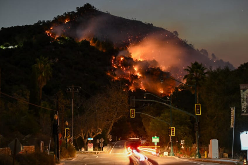 LOS ANGELES, CALIFORNIA - JANUARY 9: A view of flames at the mountain as seen from Topanga