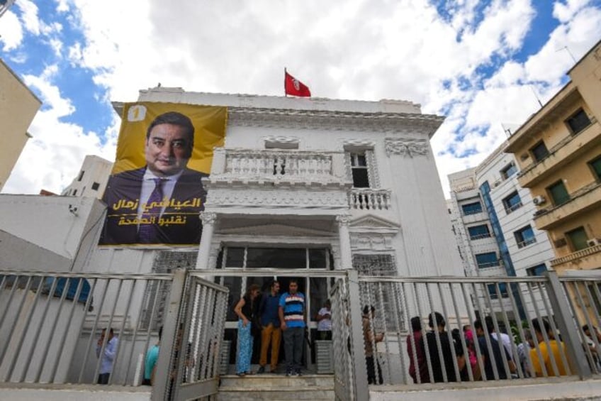 A poster of imprisoned Tunisian presidential candidate Ayachi Zammel is displayed at his e