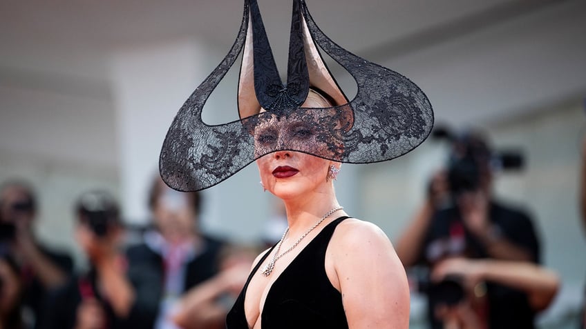 Actress Lady Gaga shows off quirky ensemble at Venice Film Festival.