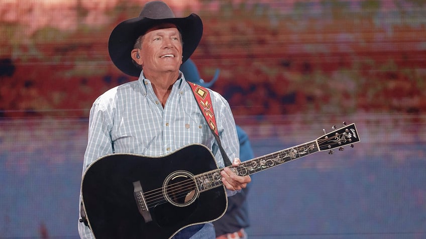 George Strait performing at the 2021 iHeartCountry Festival