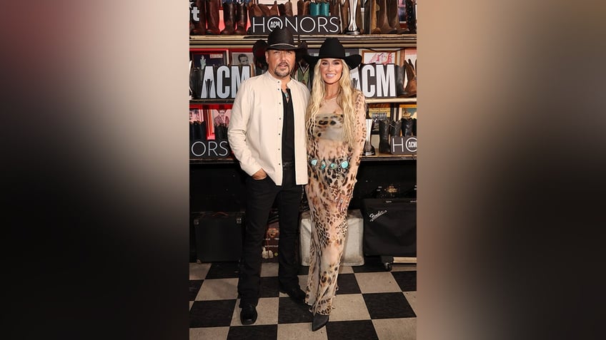 Jason and Brittany posed together at the ACM Honors in matching cowboy hats.