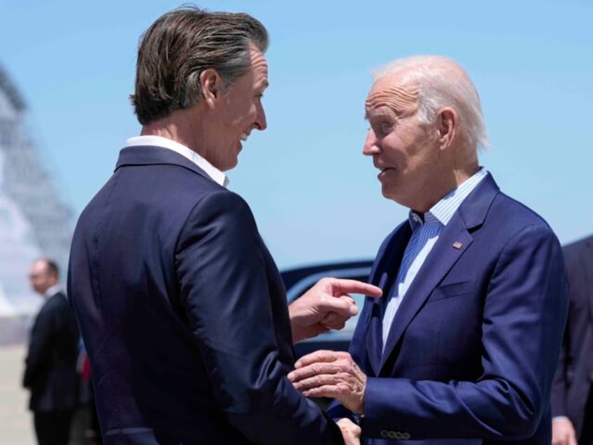 FILE - President Joe Biden shakes hands with California Gov. Gavin Newsom as he arrives at