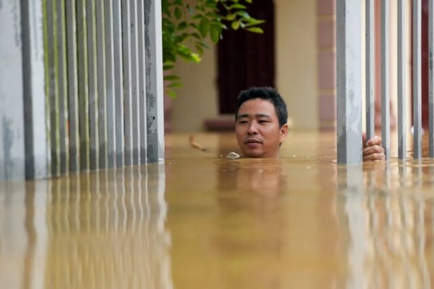 Residents in northern Vietnam flee severe flooding not seen in years