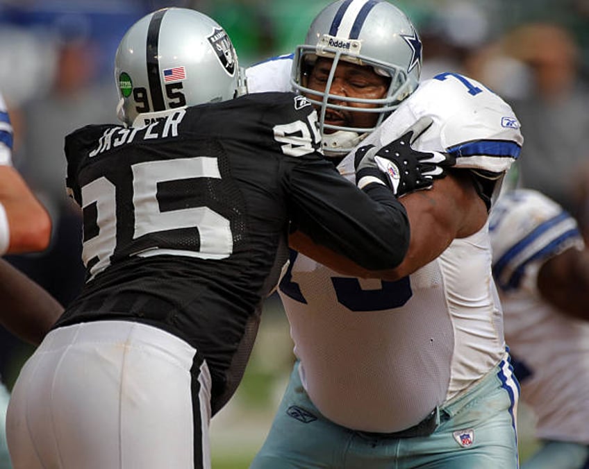 Dallas Cowboys offensive guard Larry Allen blocks against Ed Jasper of the Oakland Raiders during 19-13 loss at McAfee Coliseum in Oakland, Calif. On...
