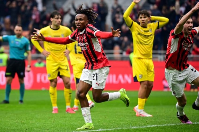 AC Milan's Nigerian midfielder Samuel Chukwueze (C) celebrates scoring his team's third go