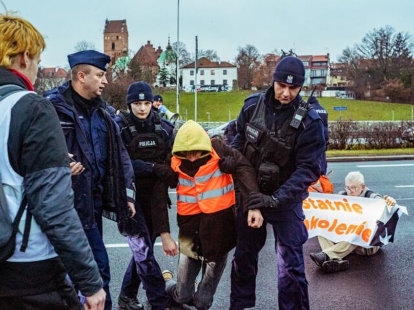WARSAW, MAZOVIA, POLAND - 2024/12/09: Police remove a protestor from the line of the block