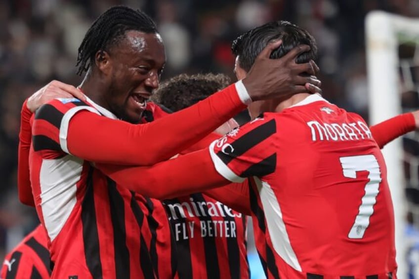 AC Milan's English forward Tammy Abraham celebrates with Spanish forward Alvaro Morata aft