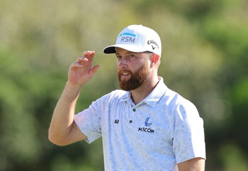 American Chris Kirk acknowledges fans after winning the 2024 US PGA Tour Sentry tournament at Kapalua, Hawaii