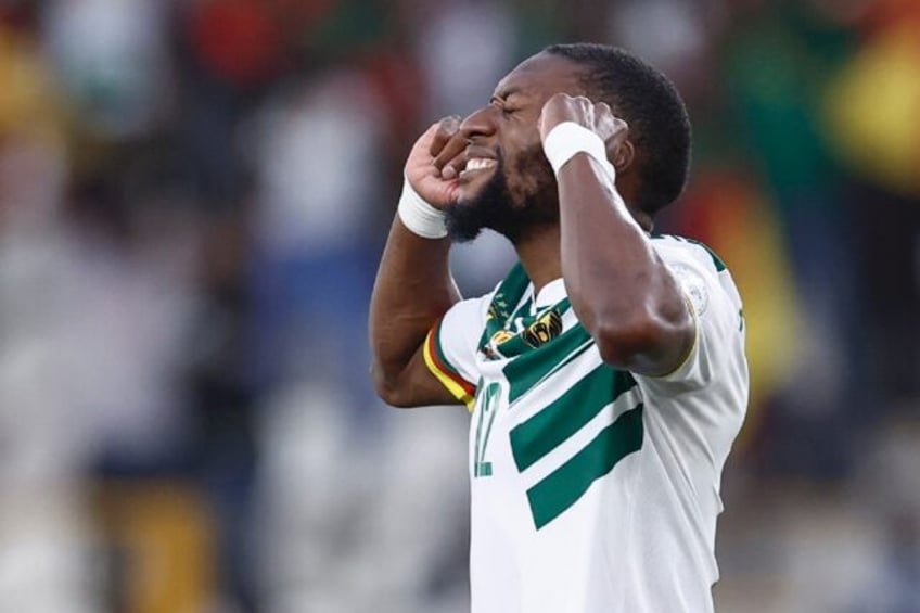 Karl Toko Ekambi celebrates scoring for Cameroon against Gambia.