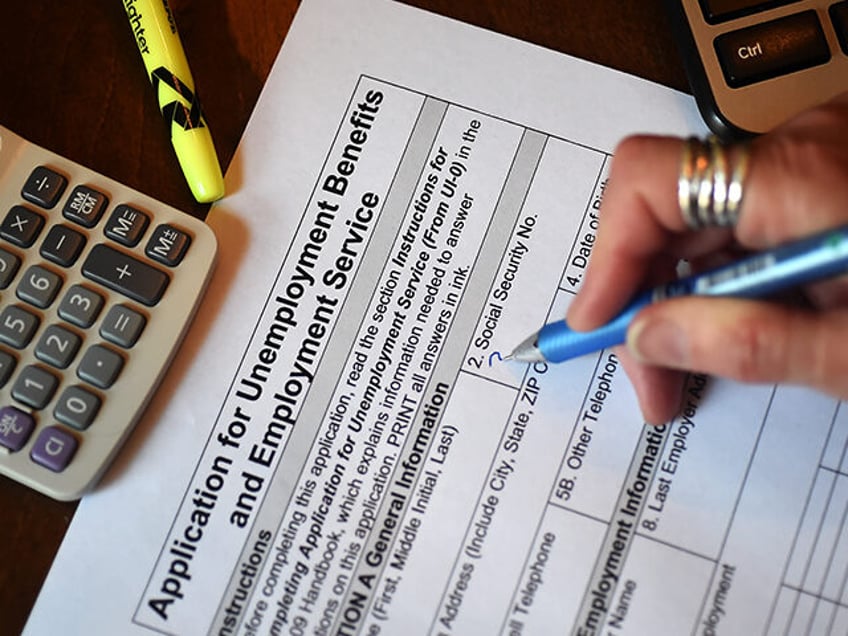 A person files an application for unemployment benefits. (Olivier Douliery/Getty Images)