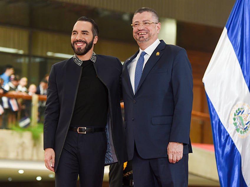 El Salvador President Nayib Bukele, left, and Costa Rica's President Rodrigo Chaves pose for photos after Bukele received the highest honor at the presidential palace in San Jose, Costa Rica, Monday, Nov. 11, 2024. (AP Photo/Jose Diaz)