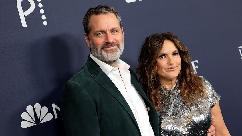 Peter Hermann and Mariska Hargitay posing together