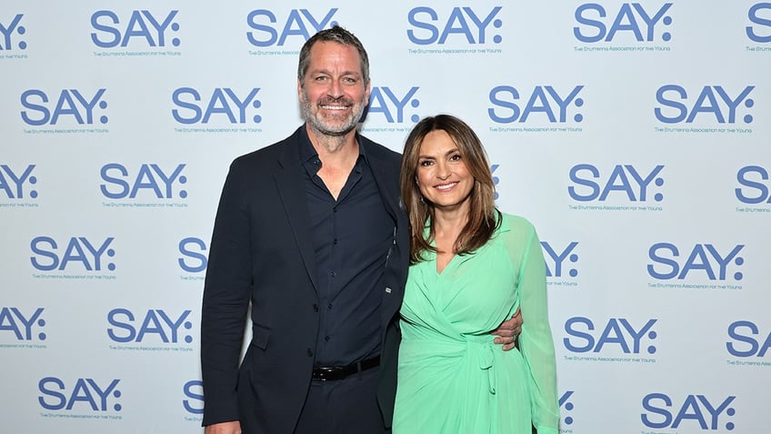 Peter Hermann posing with Mariska Hargitay