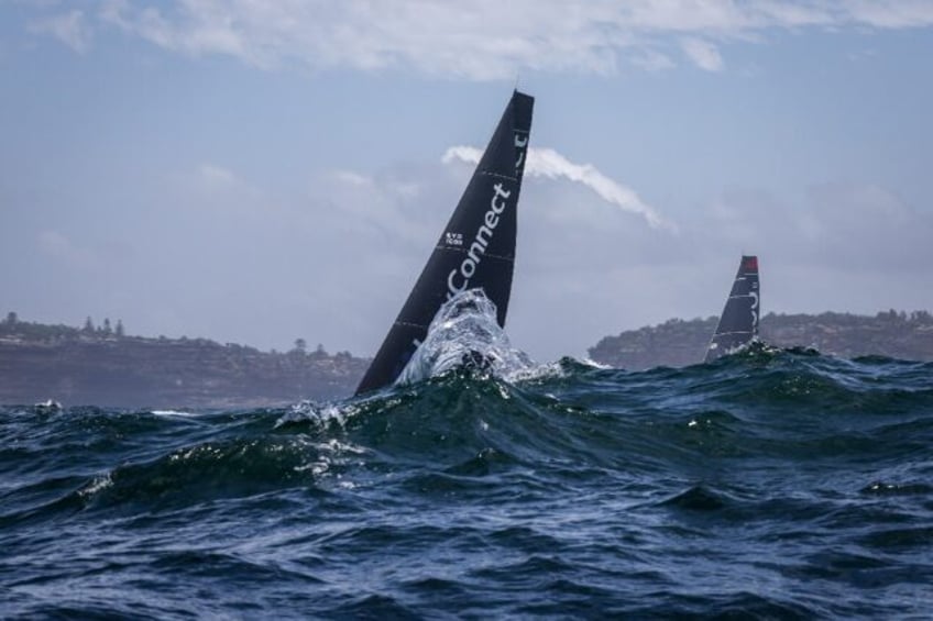 Lawconnect (left) battled Andoo Comanche (right) all the way down Australia's east coast before taking Sydney to Hobart yacht race line honours