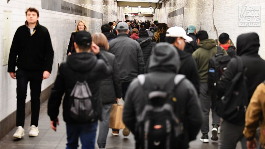 Members of the NYPD and National Guard conduct randomized bag searches in New York City’s subway system