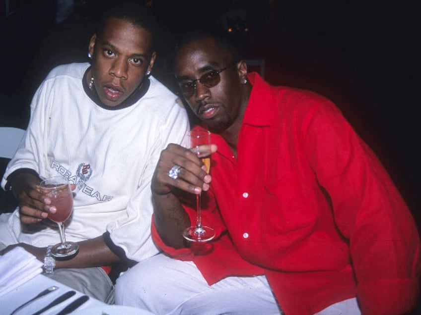 EAST HAMPTON, NY - JULY 2: Jay-Z and Sean Combs attend Puffy's Fourth of July Party a