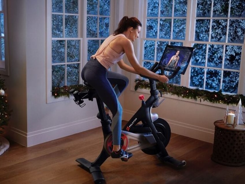 Woman on Peloton bike