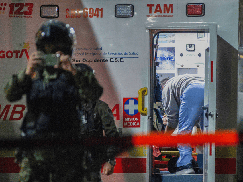 TOPSHOT - Senator Miguel Uribe Turbay receives medical treatment in an ambulance after bei