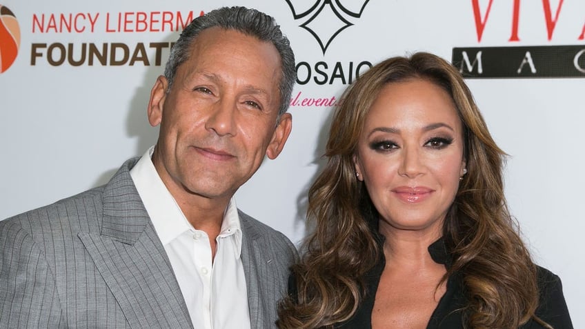 A photo of Angelo Pagan and Leah Remini