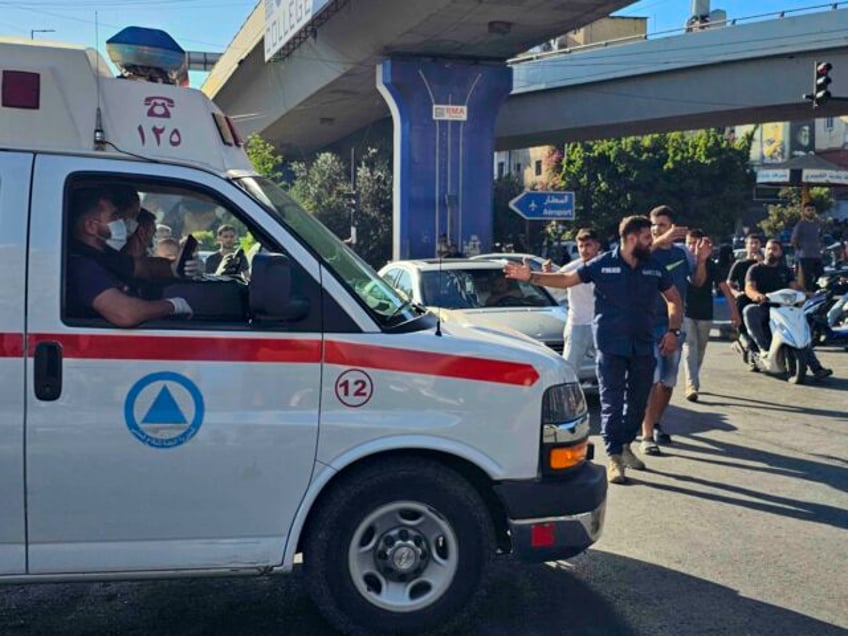 An ambulance carries wounded people whose handheld pager exploded, in Beirut, Lebanon, Tue