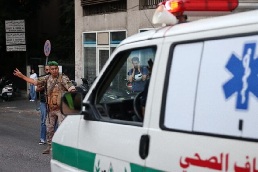 An ambulance rushes people to hospital in Beirut, after paging device explosions