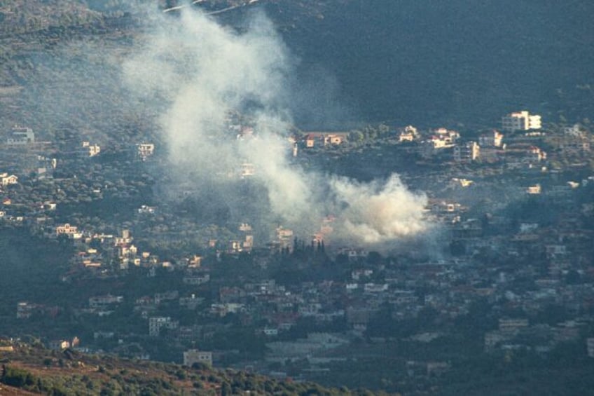 Smoke bilows following an Israeli strike in the village of Kfar Kila in southern Lebanon o