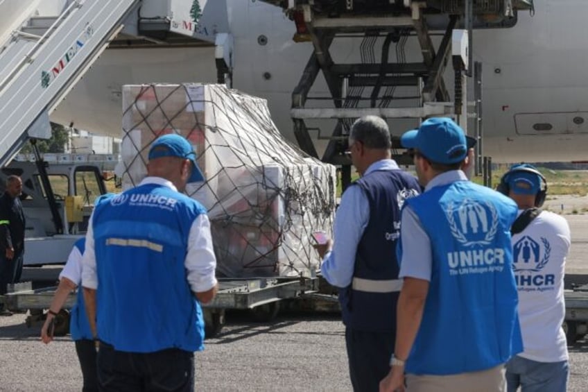 Staff unload a medical aid shipment at the Beirut International Airport