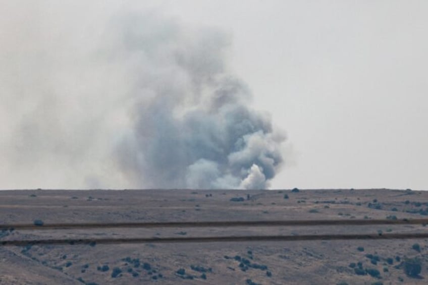 Smoke billows after a hit from a rocket fired from southern Lebanon over the Upper Galilee