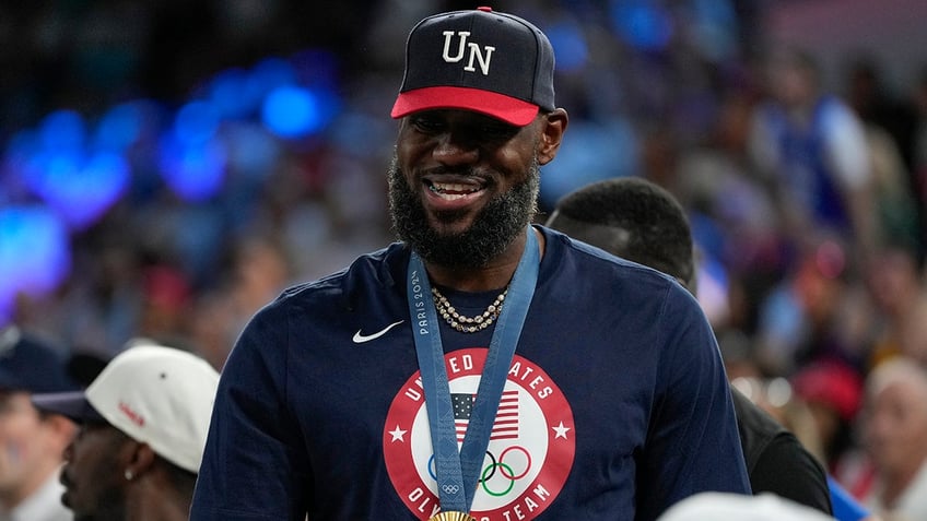 LeBron James takes in a US women's game