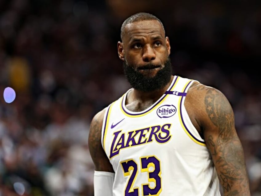 MINNEAPOLIS, MINNESOTA - APRIL 27: LeBron James #23 of the Los Angeles Lakers looks on aga