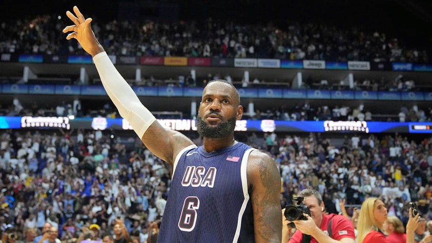 LeBron James waves to the crowd