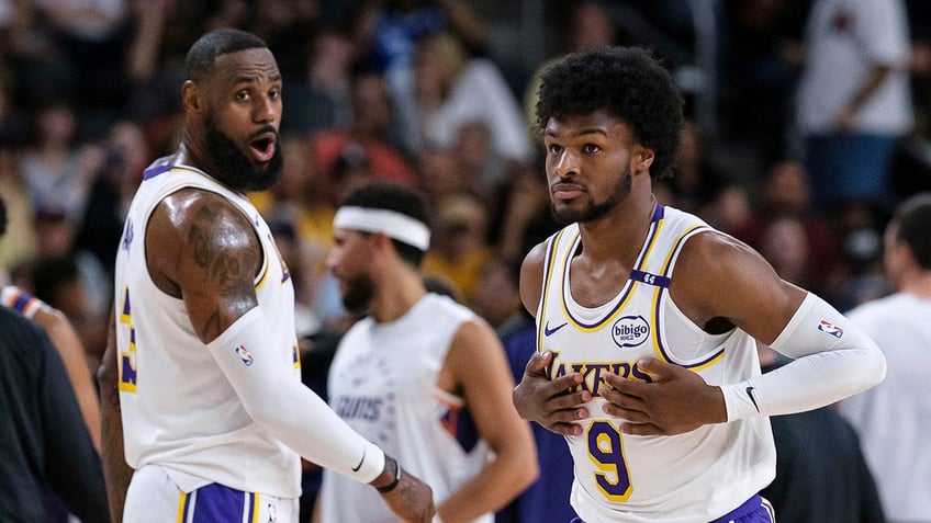 LeBron and Bronny James warm up