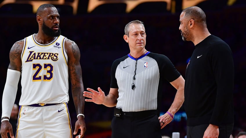 lebron james rockets coach get into heated spat during game