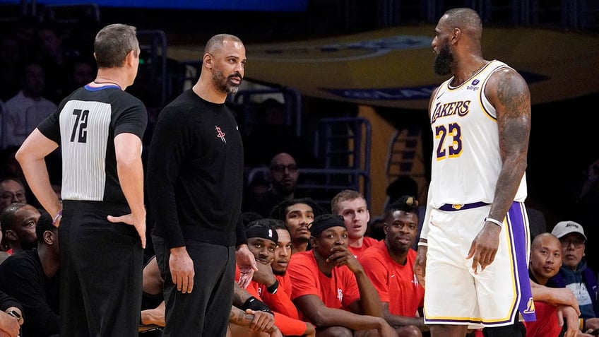 lebron james rockets coach get into heated spat during game