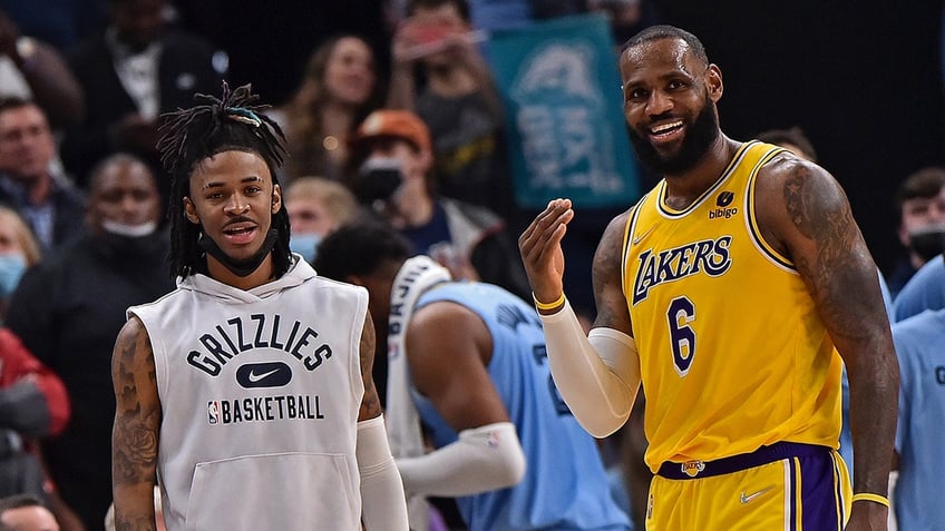 LeBron James and Ja Morant talk on court