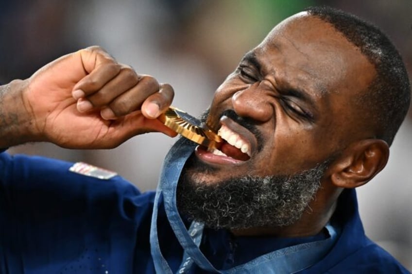 LeBron James celebrates winning his third Olympic gold