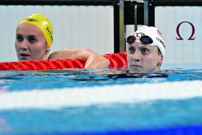 Katie Ledecky (R) beat Australia's Ariarne Titmus in the Olympic 800m freestyle heats