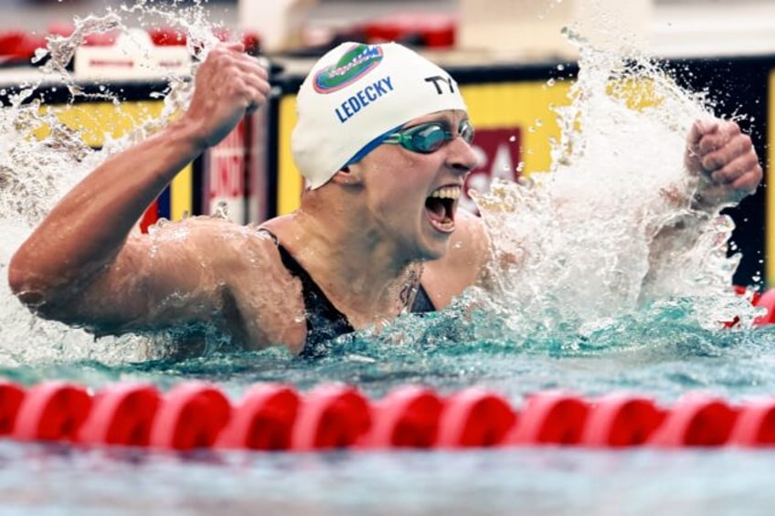Katie Ledecky celebrates her world record in the 800m freestyle at the Pro Swim Series mee