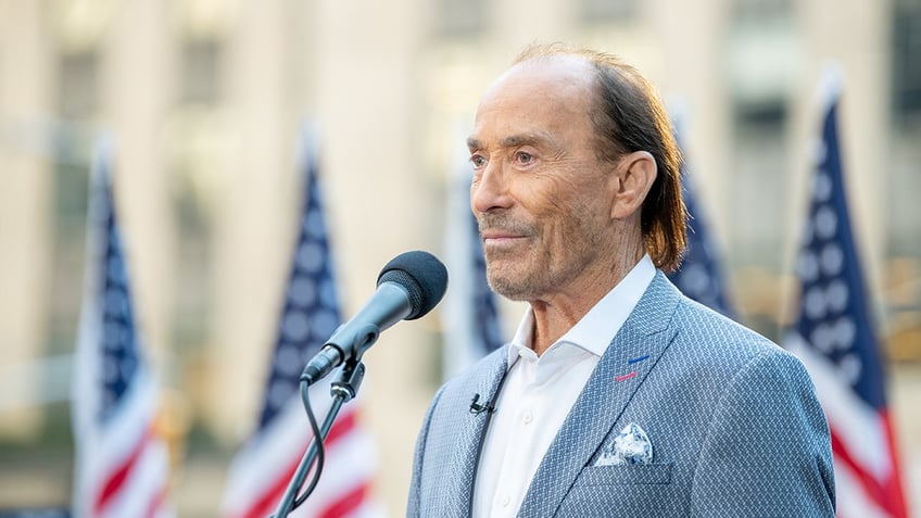 Lee Greenwood with flags