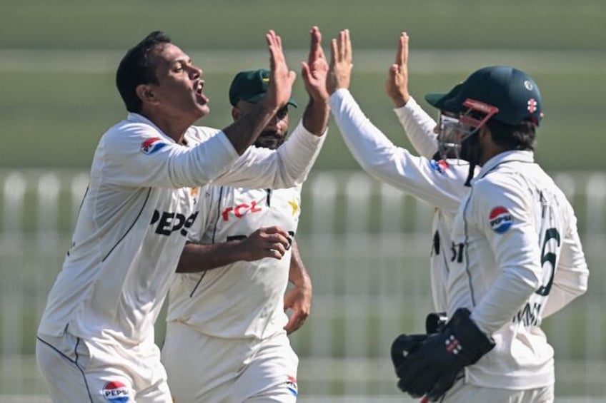 Pakistan's Noman Ali celebrates the wicket of England's captain Ben Stokes in Rawalpindi